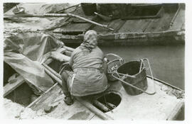 [Woman working in boat]